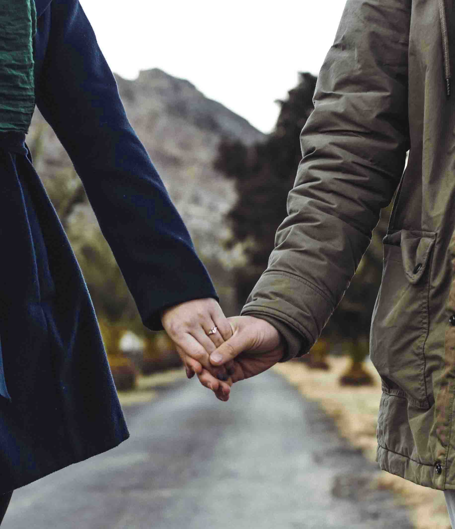 Couple holding hands